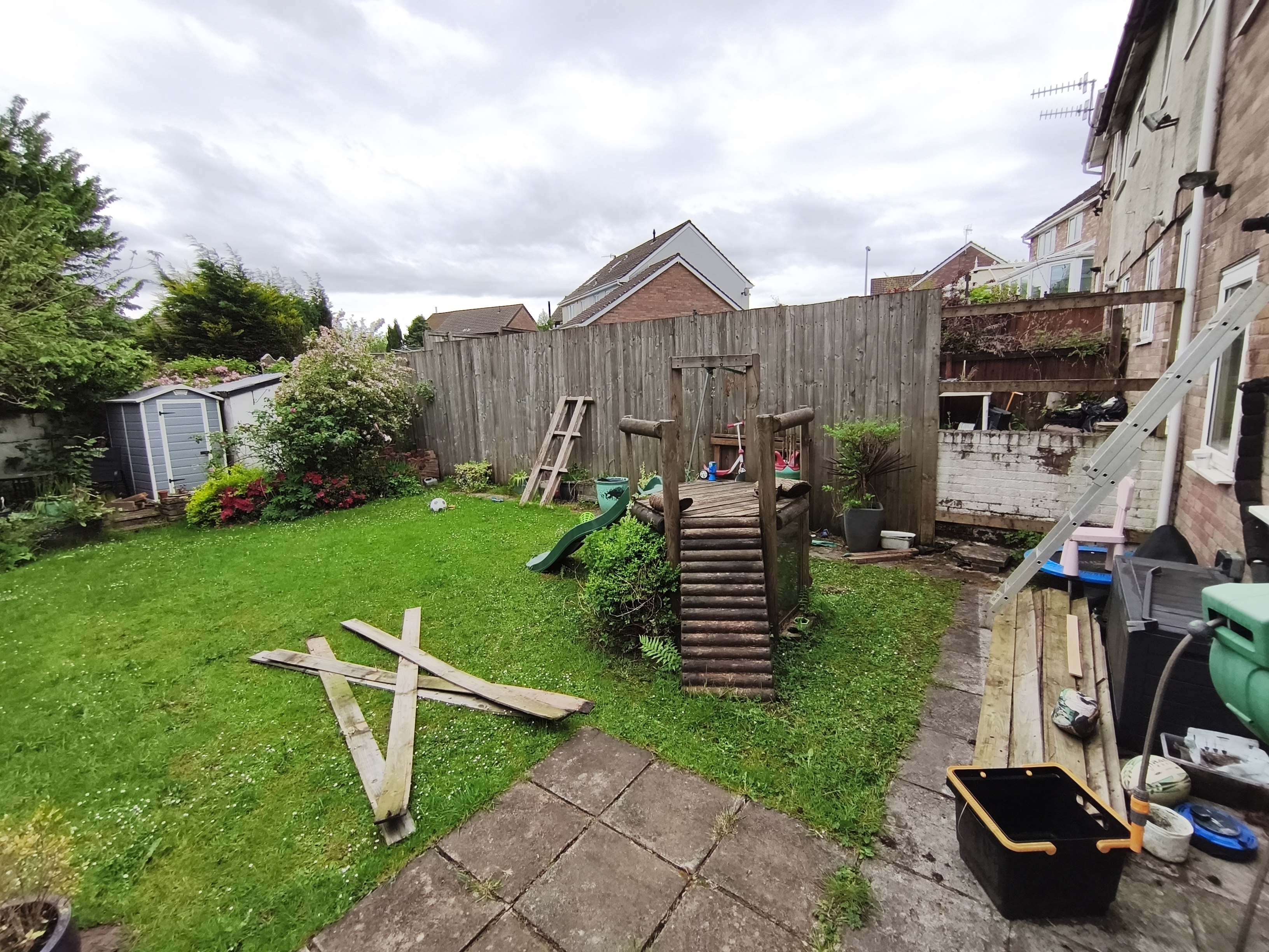 Before fence rebuild: old damaged fence panels