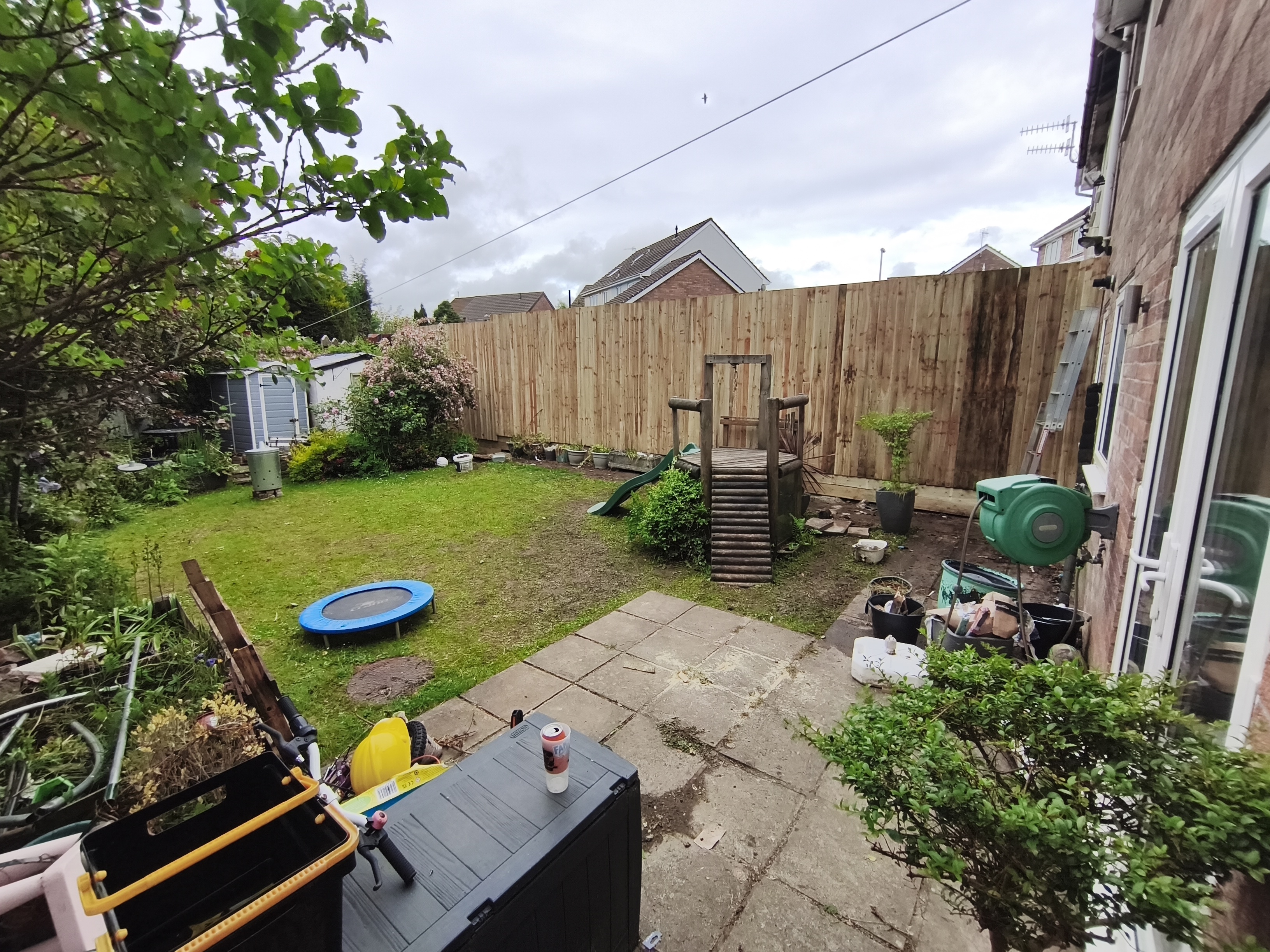 After fence rebuild: newly installed fence with a clean finish
