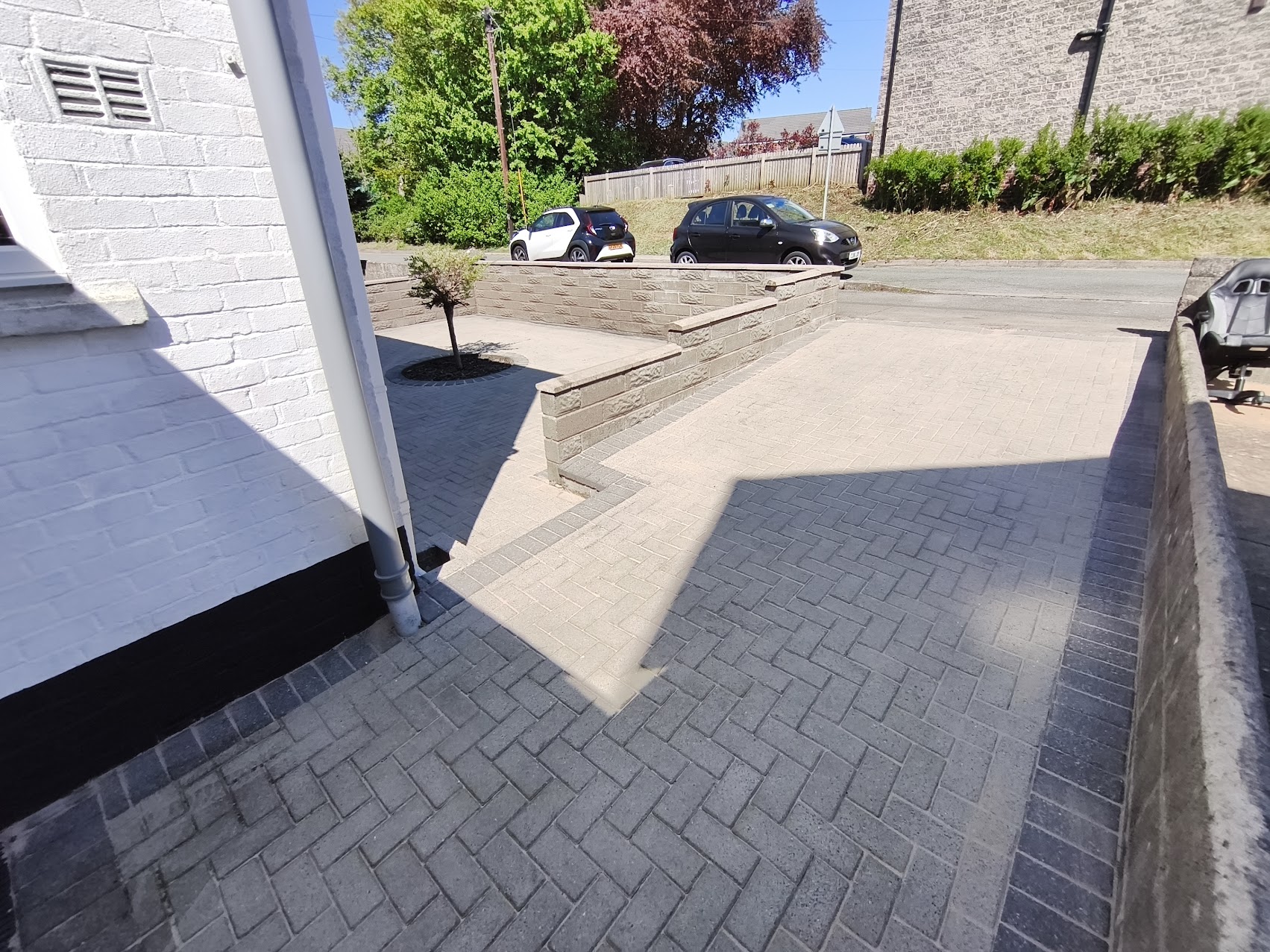 After driveway cleaning: restored paving colour and cleaner surface